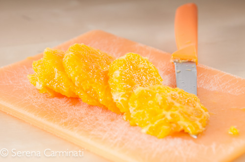 Step 2. Peel and cut the oranges .