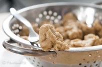 How to make seitan (piece of seitan on a fork, front view,close-up)