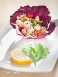 Barley and shrimp salad in red cabbage leaves 