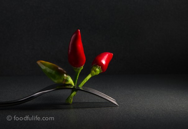 Chilli peppers on fork