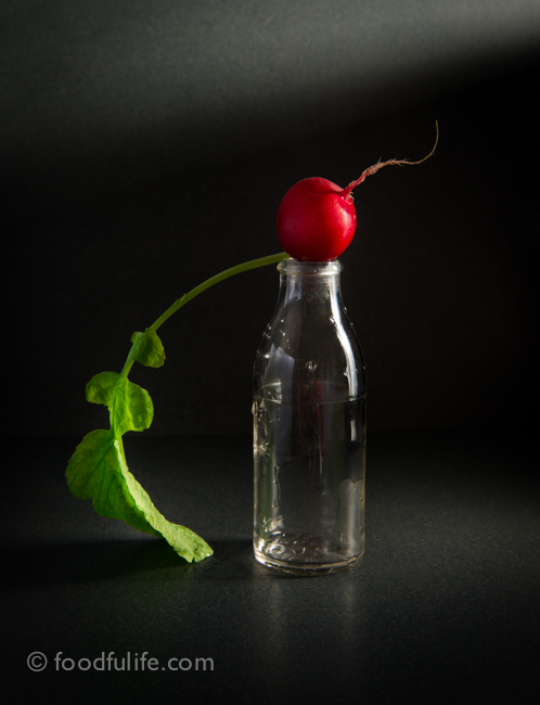 Radish on glass bottle