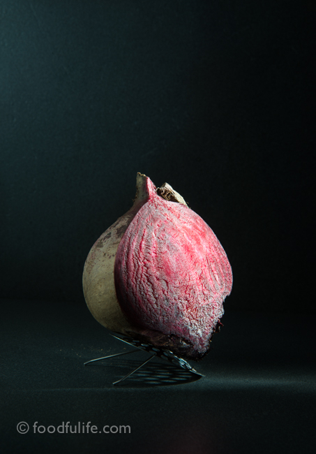 Raw beetroot on sink strainer